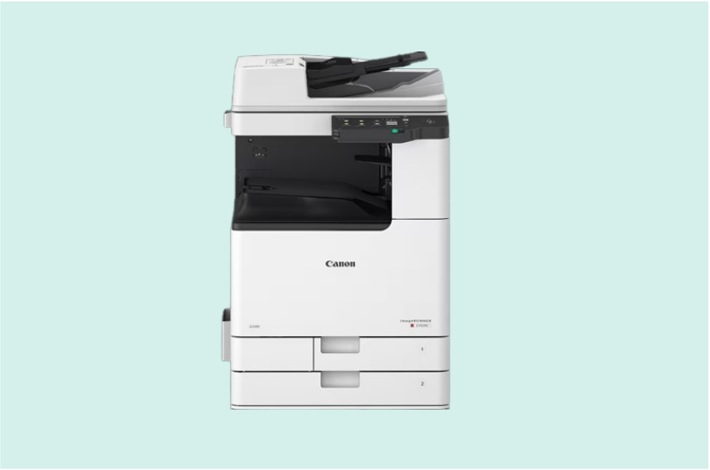 Impresora inkjet compacta de color blanco con cartuchos de tinta visibles, ideal para uso doméstico y pequeña oficina